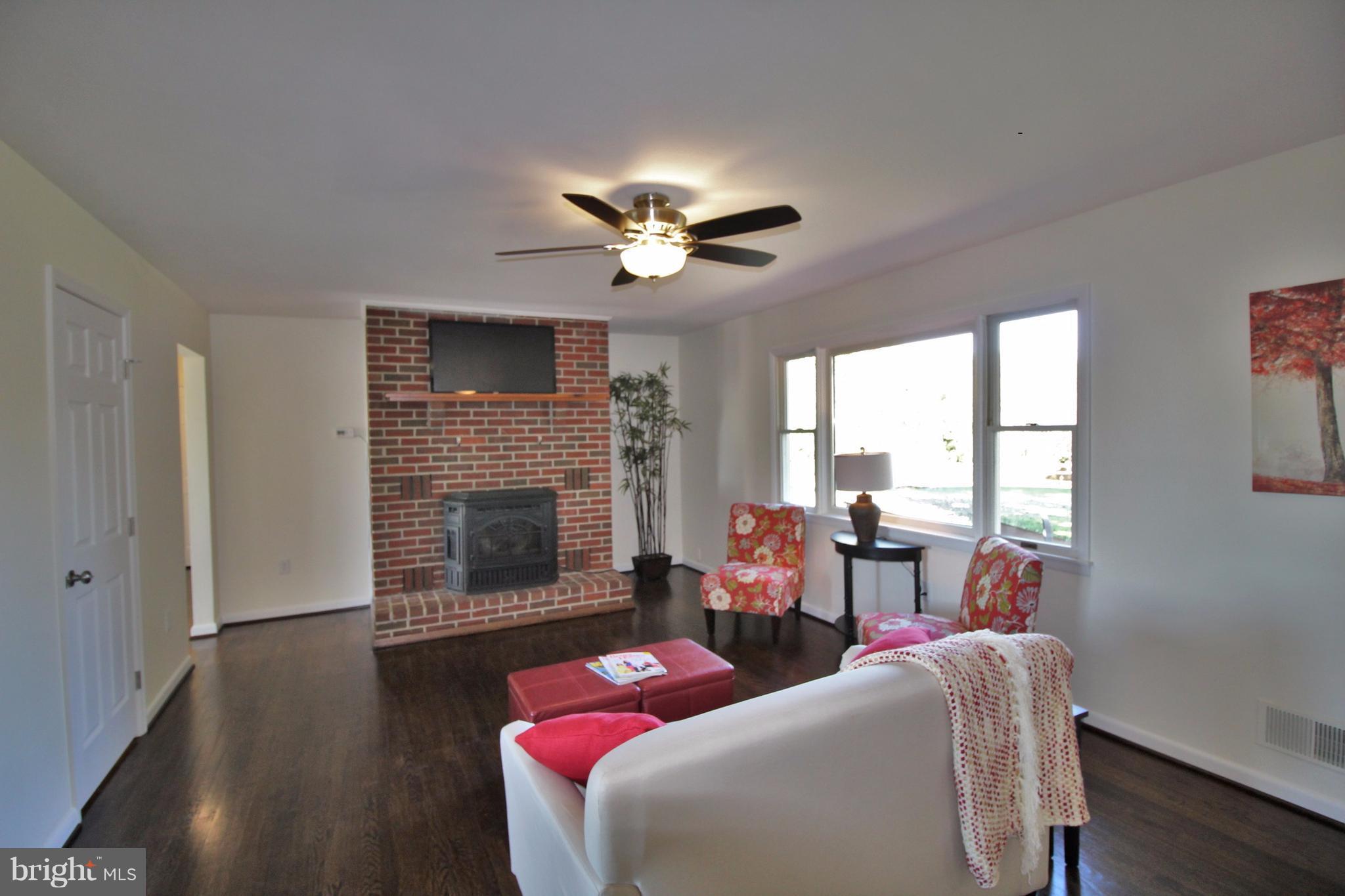 12805 Bunker Hill Road Union Bridge, MD 21791 - Photo 10 of 30 a living room with furniture and a fireplace