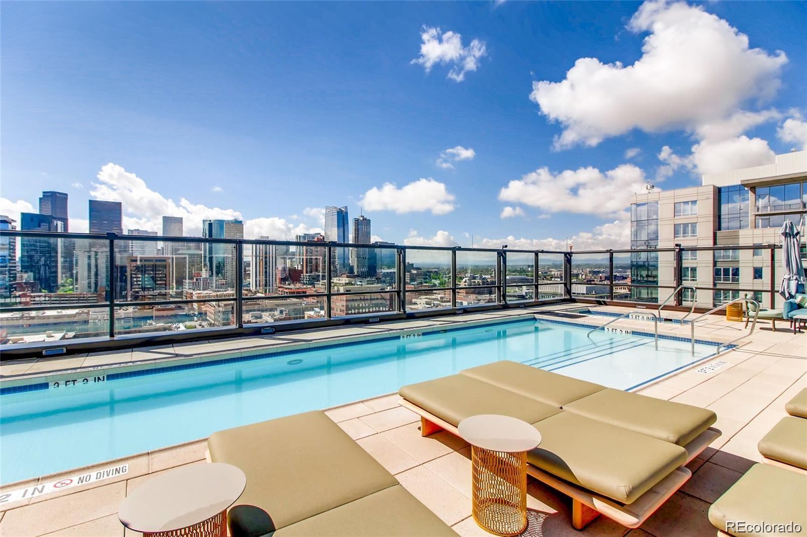 1750 Wewatta Street, Unit 1202 Denver, CO 80202 - Photo 12 of 16 a view of a swimming pool with outdoor seating