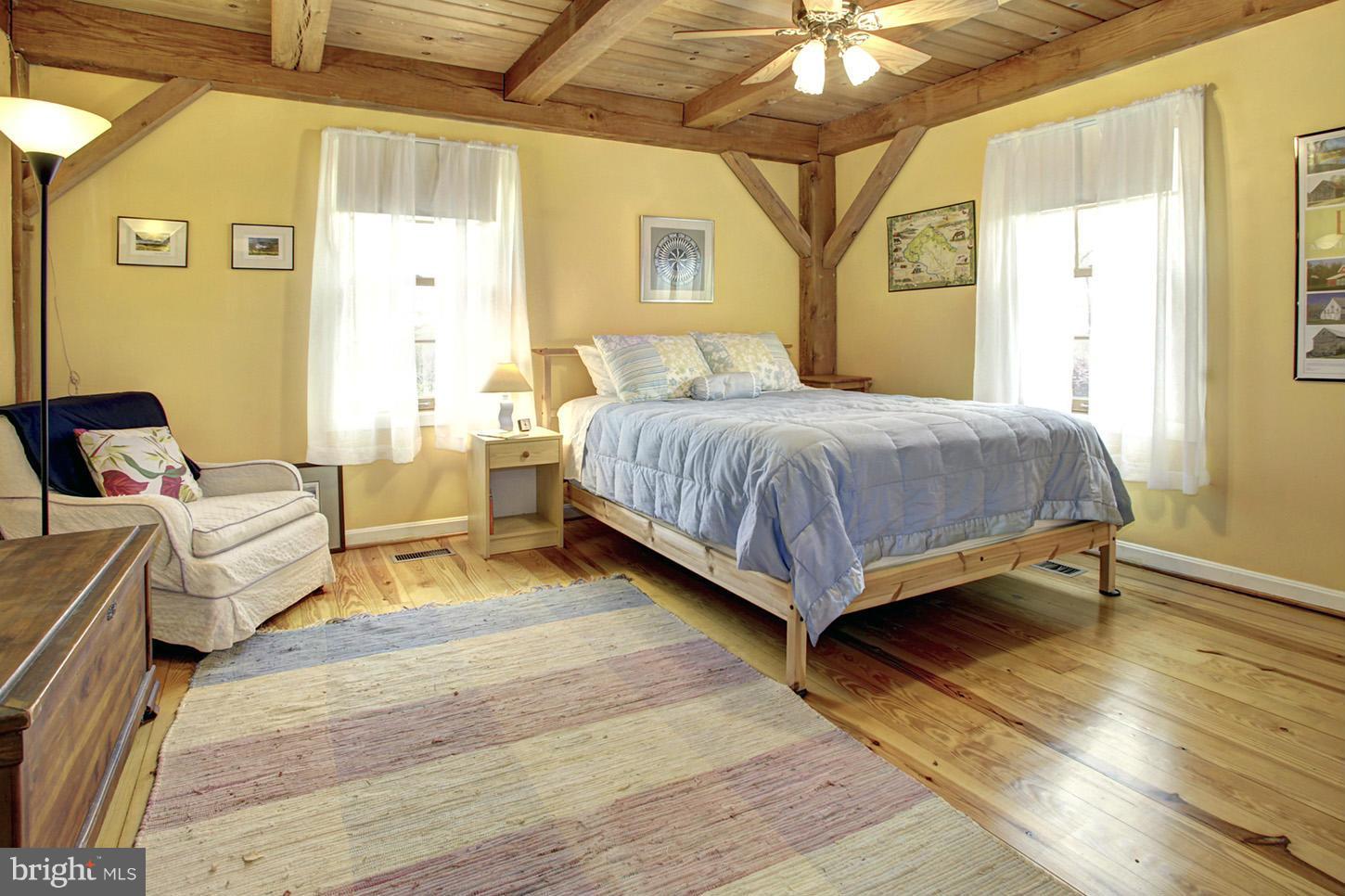 22316 West Harris Road Barnesville, MD 20838 - Photo 14 of 30 a bedroom with a bed and a chandelier
