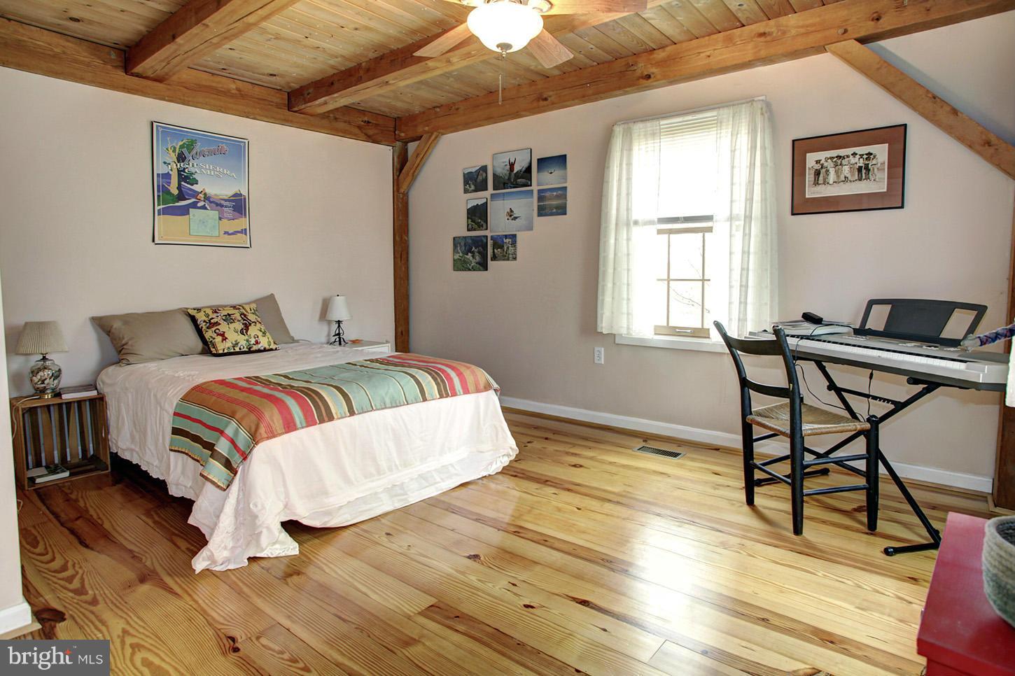 22316 West Harris Road Barnesville, MD 20838 - Photo 15 of 30 a bedroom with a bed and a table