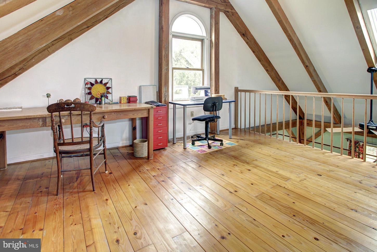 22316 West Harris Road Barnesville, MD 20838 - Photo 22 of 30 a view of a workspace with wooden floor and furniture