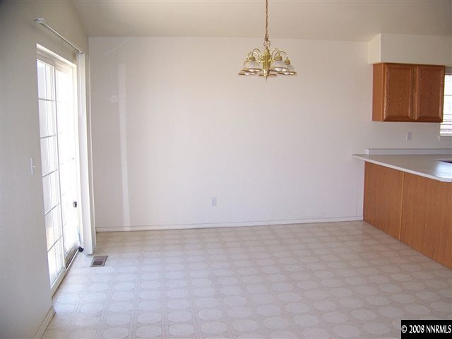 1170 Lattin Road Fallon, NV 89406 - Photo 2 of 6 an empty room with chandelier fan