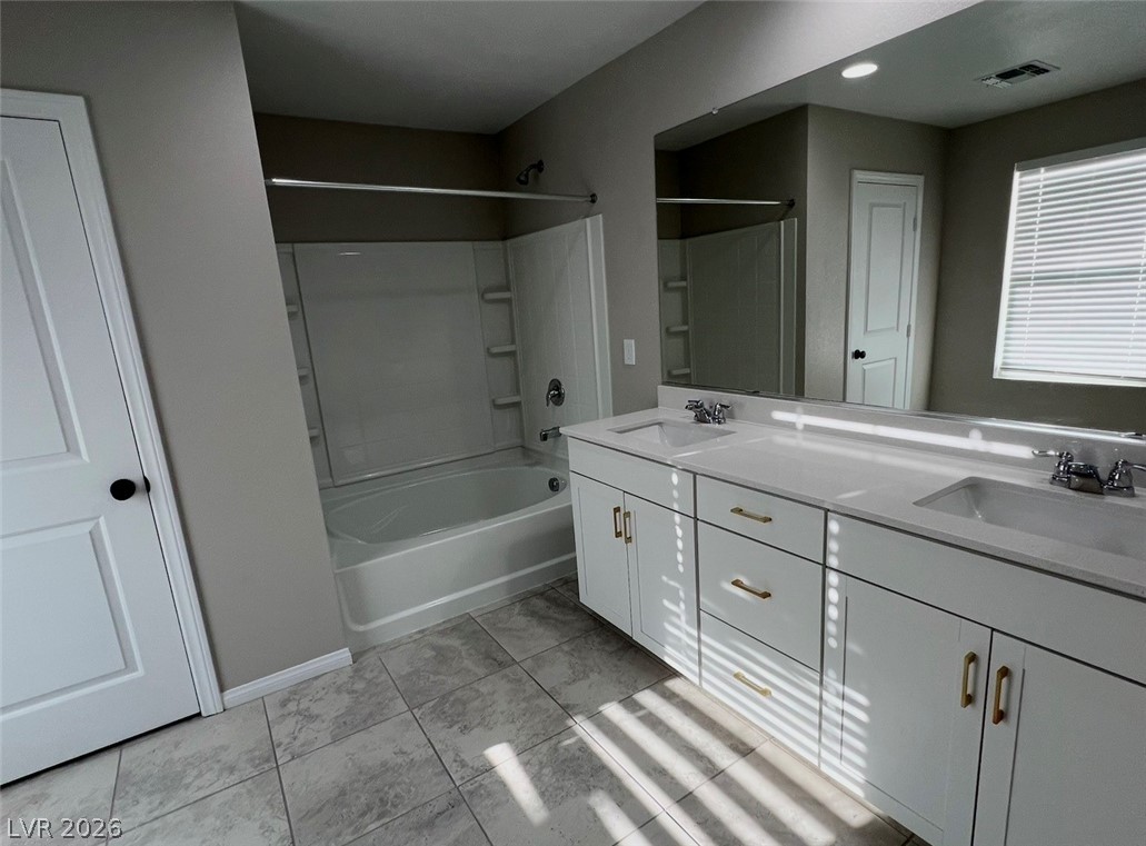6905 Diablo Rim Street North Las Vegas, NV 89086 - Photo 25 of 39 This bathroom features a double vanity and sleek modern design.