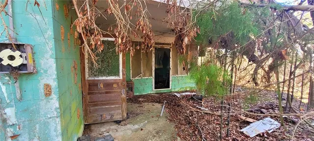 a view of a house with a tree