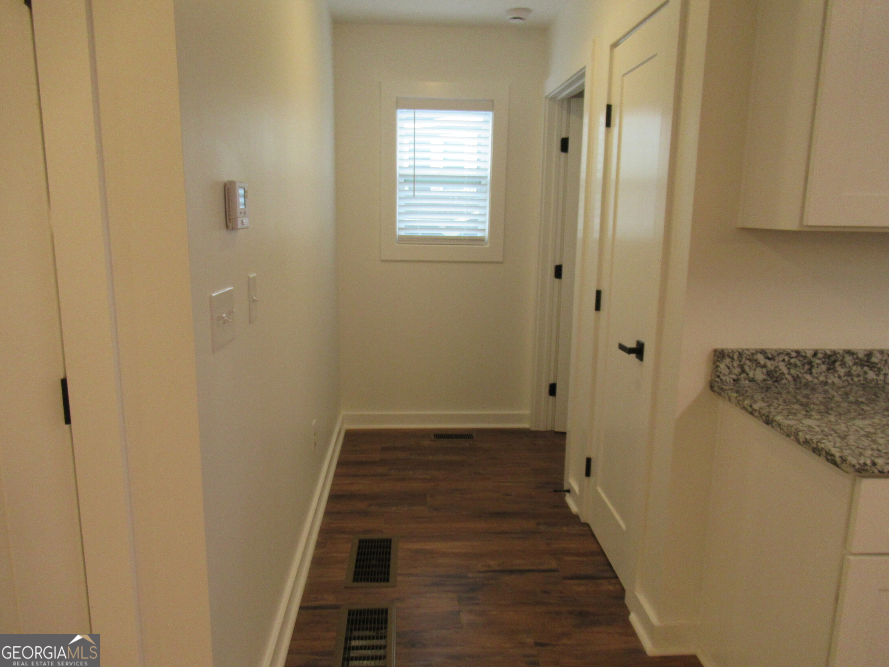 765 Old Kerns Road Dawsonville, GA 30534 - Photo 9 of 36 a view of a bathroom from the hallway