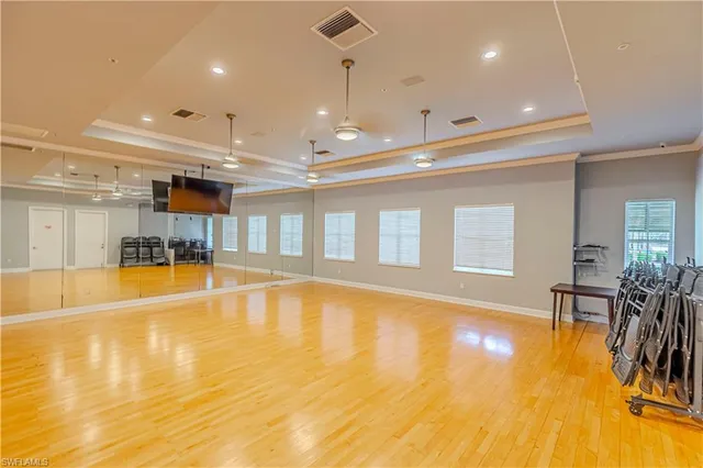 a view of a swimming pool and furniture