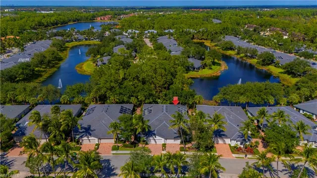 an aerial view of residential house with outdoor space and swimming pool