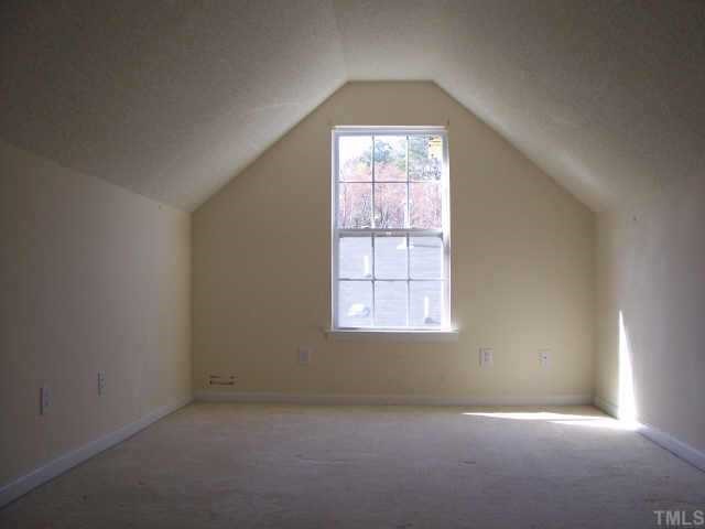 4836 Silverdene Street Raleigh, NC 27616 - Photo 6 of 9 an empty room with a window