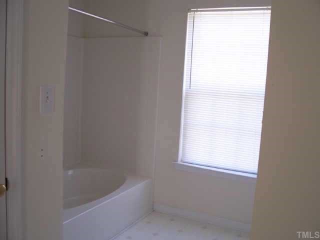 4836 Silverdene Street Raleigh, NC 27616 - Photo 7 of 9 a bath tub sitting next to a window