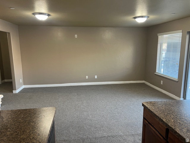 917 South Main Street, Unit H Layton, UT 84041 - Photo 8 of 19 Spare room featuring light colored carpet