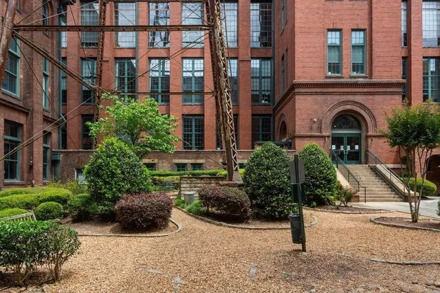 a view of a building with a yard