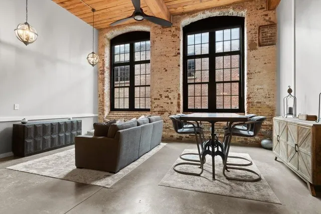 a living room with furniture and a window