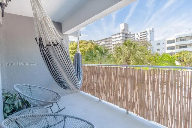 a balcony view with a seating space