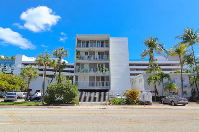 a front view of a building with tree s