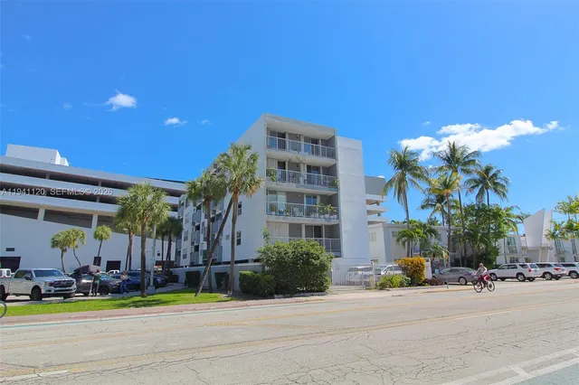 a group of people sitting in front of a building