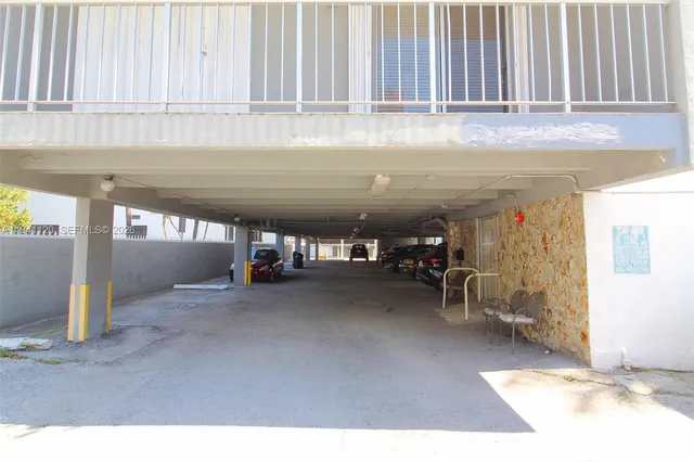 a view of parking garage with cars