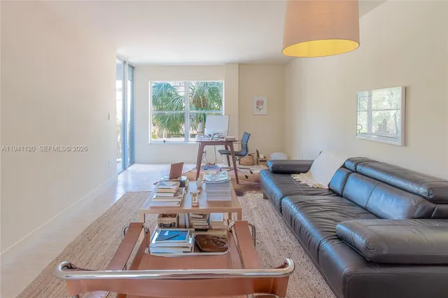 a living room with furniture and a window