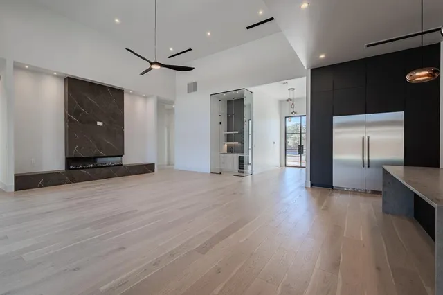 a view of a kitchen with a sink and a ceiling fan