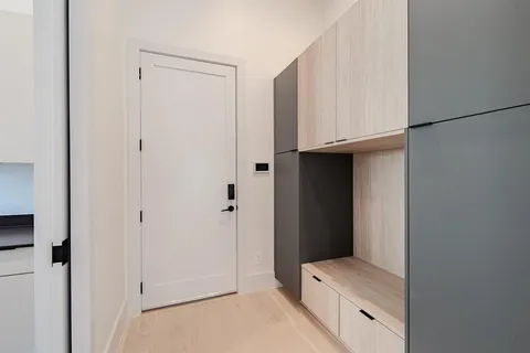 a room with a furniture and a hallway