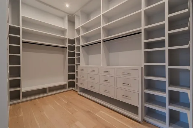 a view of an empty walk in closet