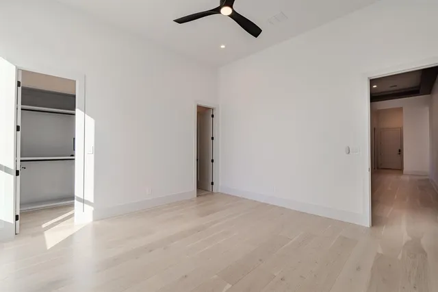 an empty room with a empty space and windows