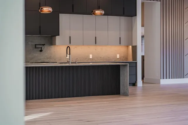 a kitchen with a sink and cabinets