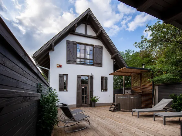 a front view of a house with sitting area