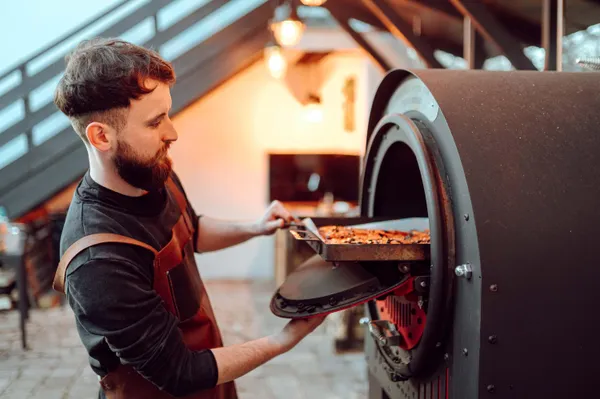 a large kitchen with a table and chairs