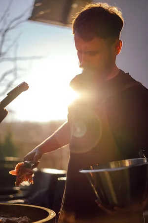a kitchen with a table chairs sink and stove