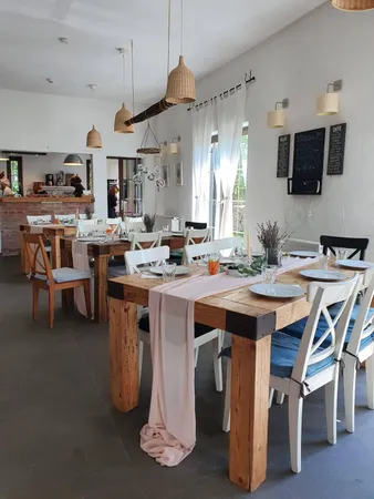 a view of a patio with table and chairs