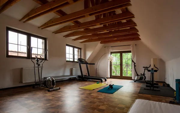 a view of a livingroom with furniture and staircase