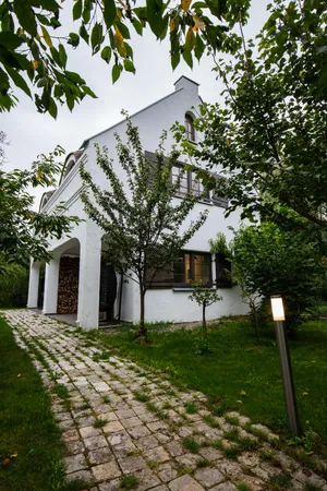 a view of house with backyard outdoor seating and green space