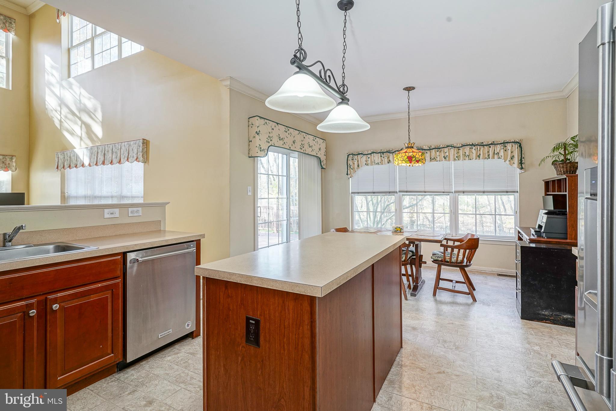 6 Sylvan Court Delran, NJ 08075 - Photo 14 of 49 a kitchen with a stove a sink a dining table and chairs