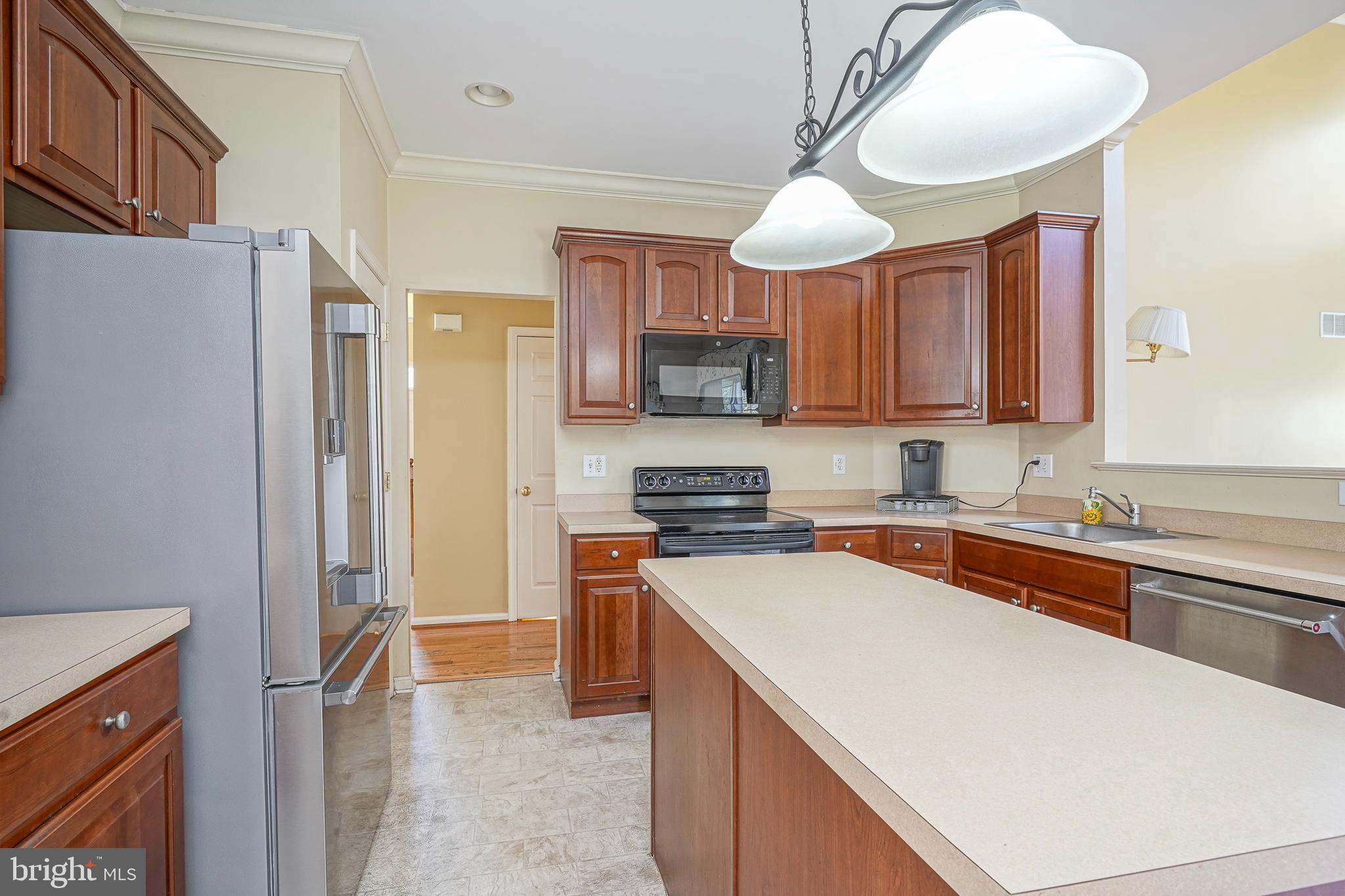 6 Sylvan Court Delran, NJ 08075 - Photo 15 of 49 a kitchen with stainless steel appliances granite countertop a refrigerator and a stove top oven