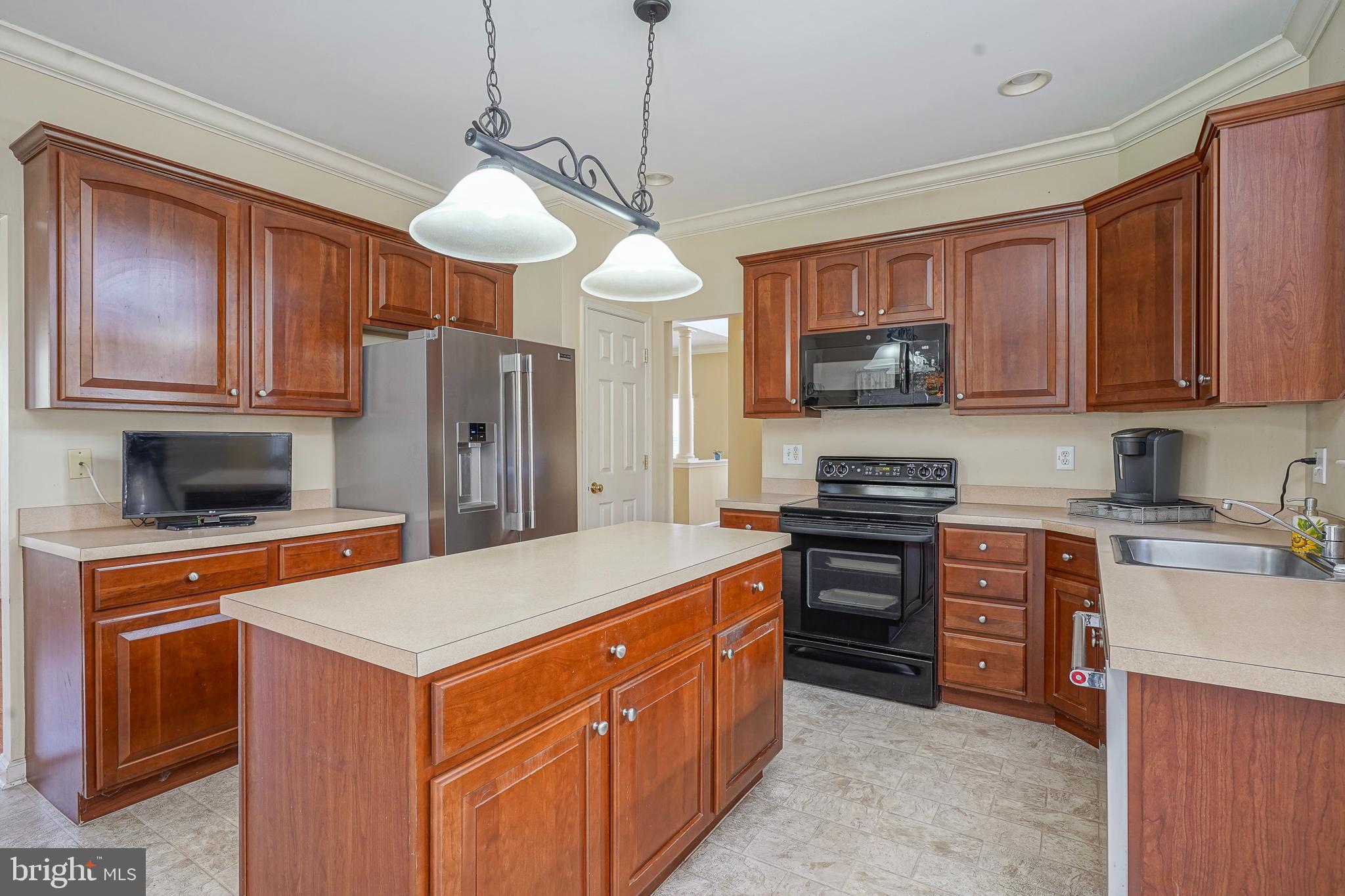 6 Sylvan Court Delran, NJ 08075 - Photo 16 of 49 a kitchen with stainless steel appliances granite countertop a stove refrigerator sink and microwave