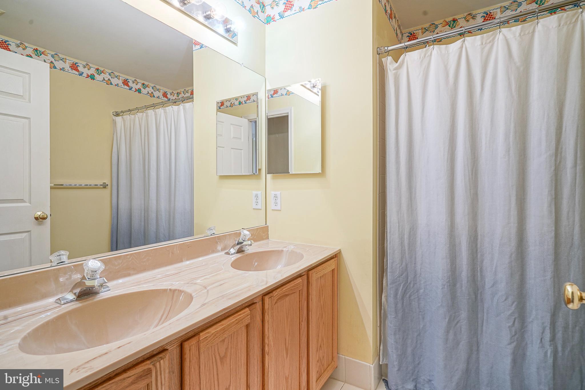 6 Sylvan Court Delran, NJ 08075 - Photo 25 of 49 a bathroom with a double vanity sink and a mirror
