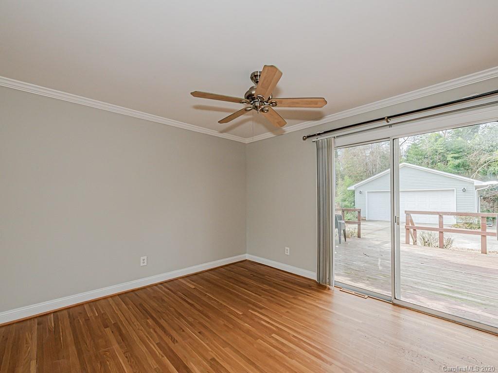 5706 Telfair Road Charlotte, NC 28210 - Photo 12 of 37 a view of empty room with wooden floor and fan