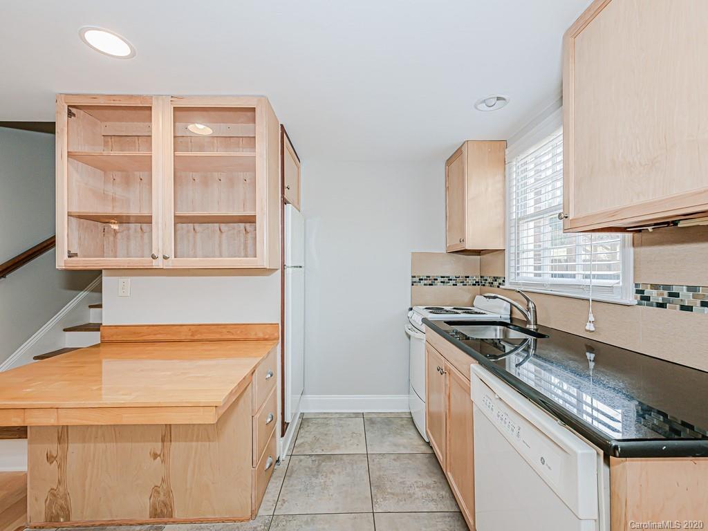 5706 Telfair Road Charlotte, NC 28210 - Photo 17 of 37 a kitchen with stainless steel appliances granite countertop a sink and a stove
