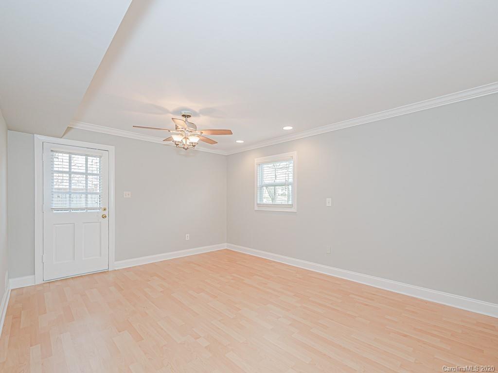 5706 Telfair Road Charlotte, NC 28210 - Photo 19 of 37 wooden floor in an empty room with a window