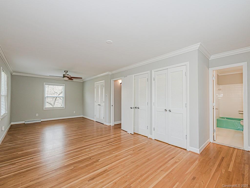 5706 Telfair Road Charlotte, NC 28210 - Photo 26 of 37 a view of an empty room with wooden floor and a window
