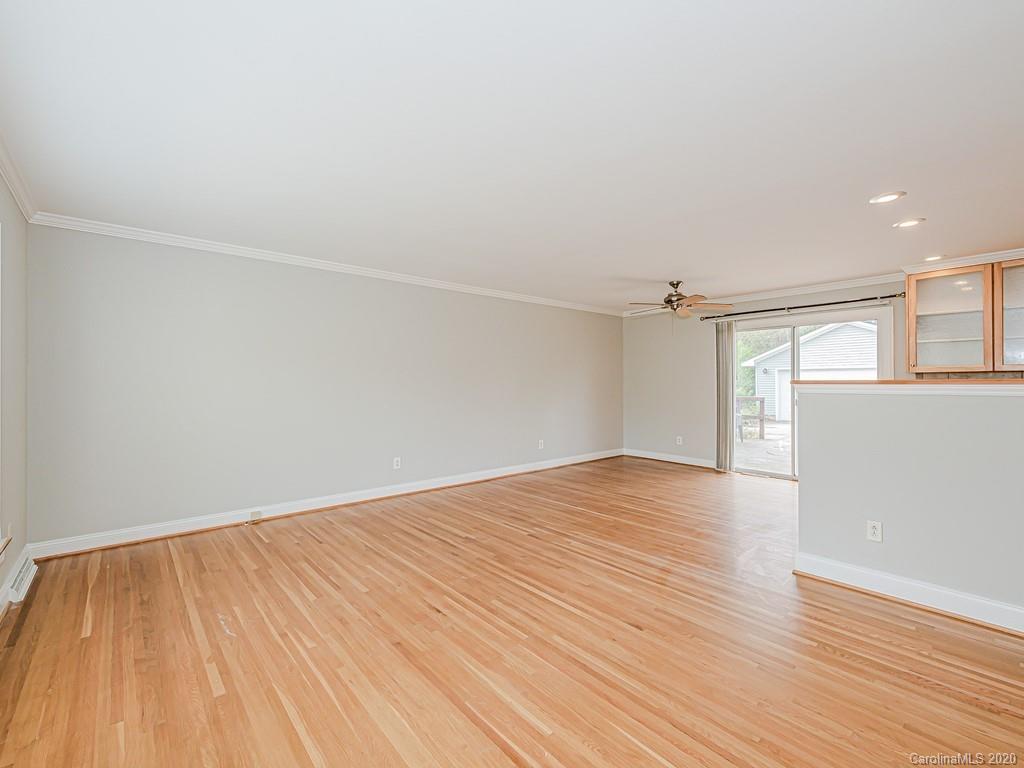 5706 Telfair Road Charlotte, NC 28210 - Photo 4 of 37 wooden floor in an empty room with a window