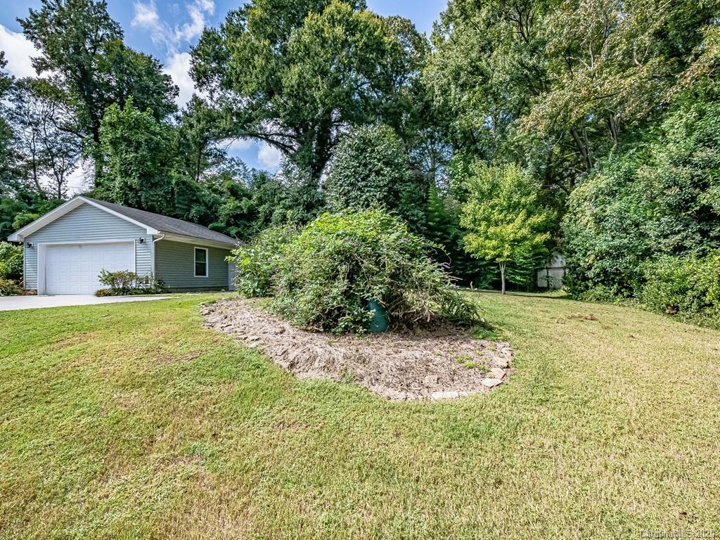 5706 Telfair Road Charlotte, NC 28210 - Photo 34 of 37 a house with a tree in front of it