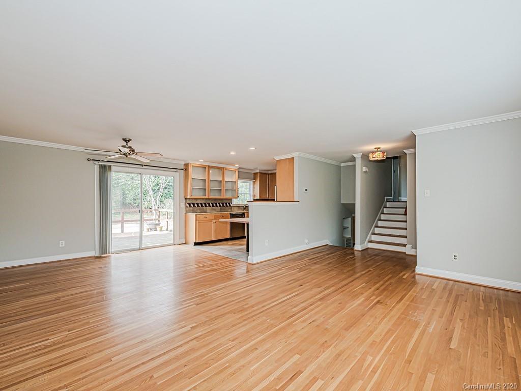 5706 Telfair Road Charlotte, NC 28210 - Photo 5 of 37 a view of an empty room with wooden floor and a window
