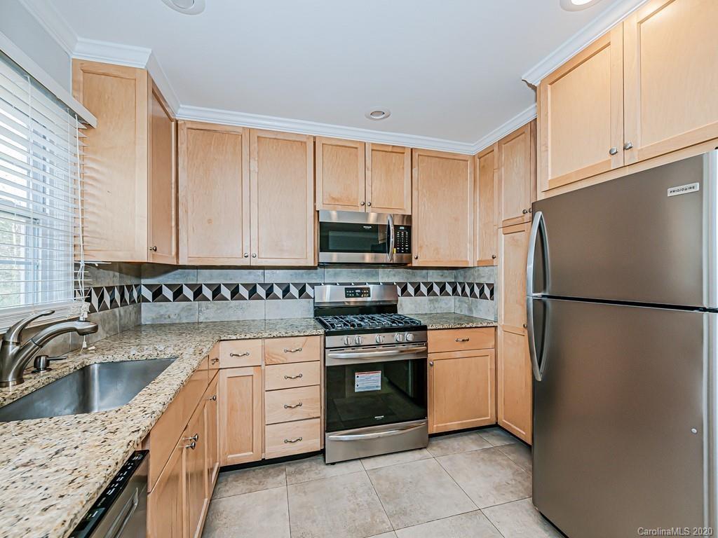 5706 Telfair Road Charlotte, NC 28210 - Photo 9 of 37 a kitchen with stainless steel appliances granite countertop a refrigerator stove and sink