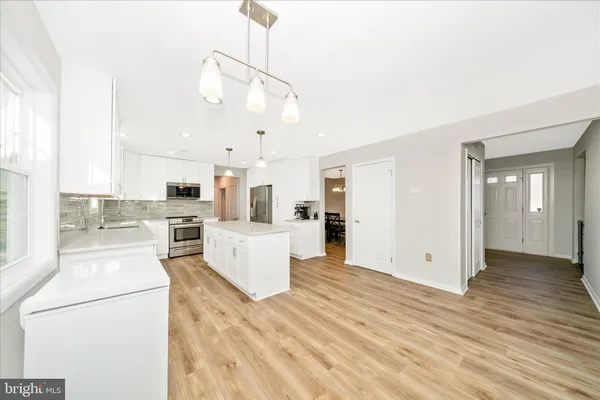 a room with natural light and wooden floor