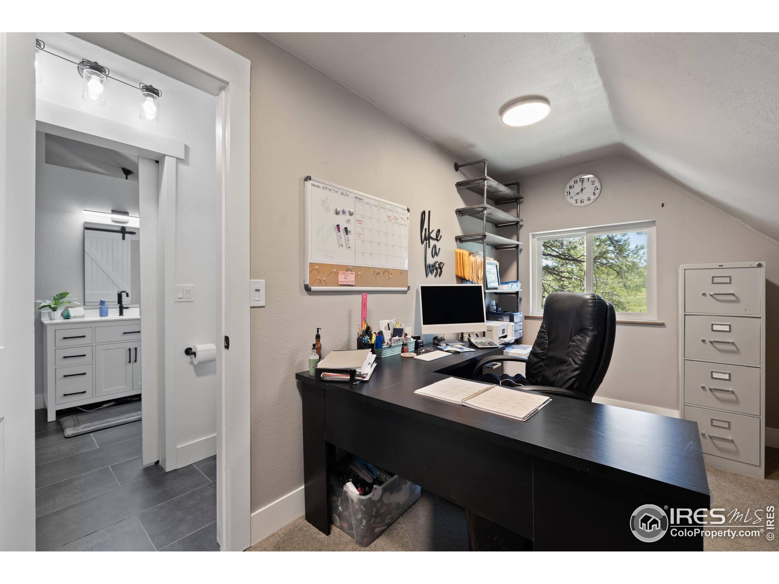 8987 Village Pines Circle Franktown, CO 80116 - Photo 12 of 31 a view of a workspace with furniture and a window