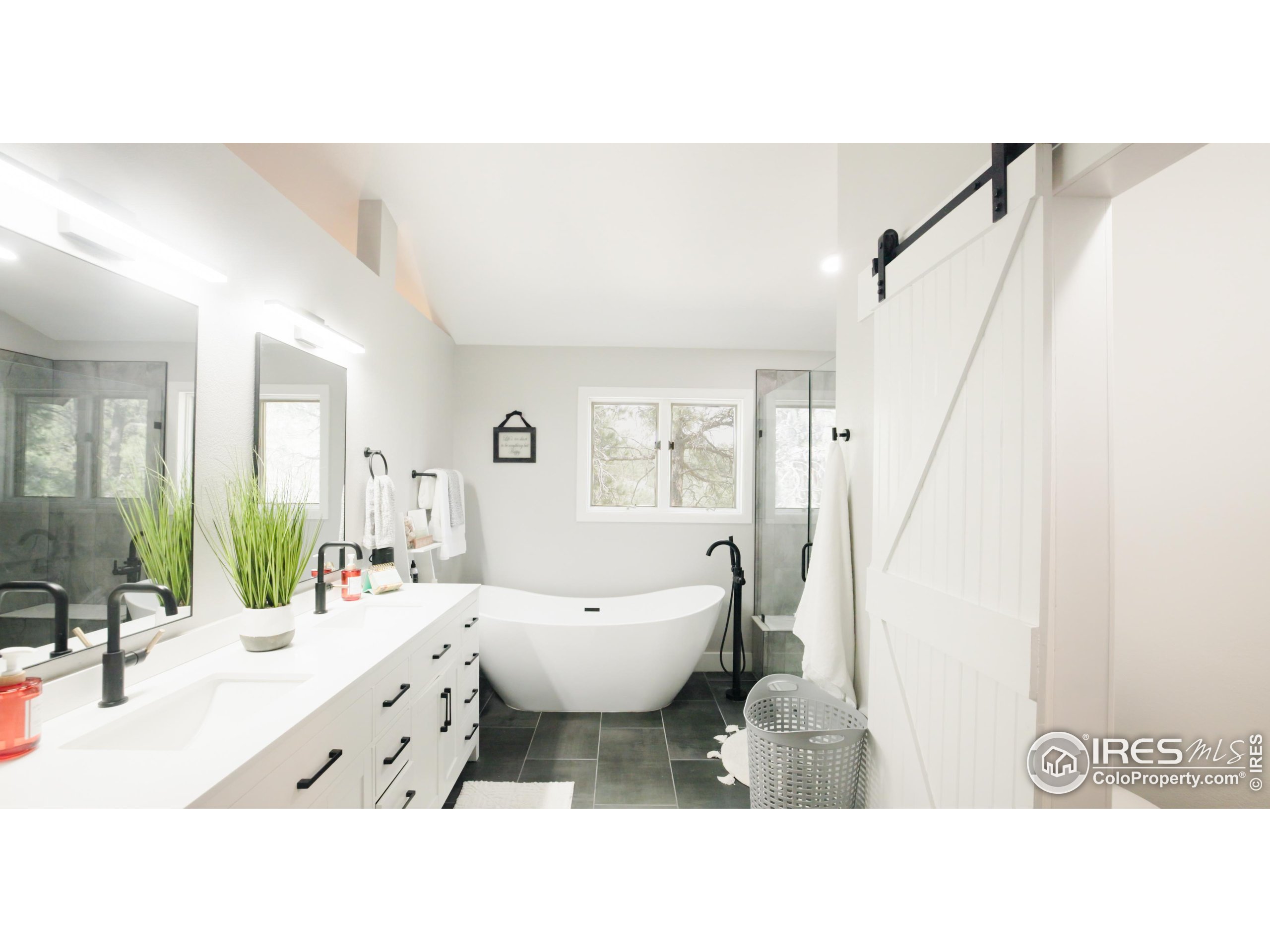 8987 Village Pines Circle Franktown, CO 80116 - Photo 10 of 31 a living room with furniture and a large window