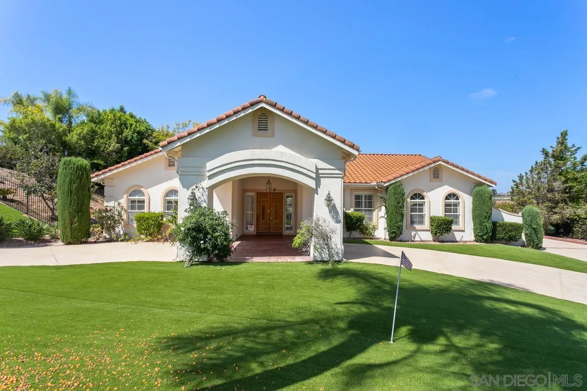 4103 Fallsbrae Road Fallbrook, CA 92028 - Photo 1 of 48 a front view of a house with garden and trees