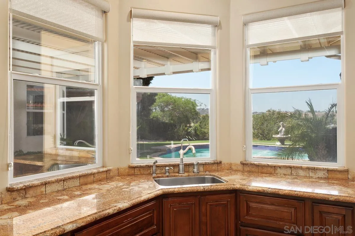 4103 Fallsbrae Road Fallbrook, CA 92028 - Photo 14 of 48 a view of a sink and a granite top