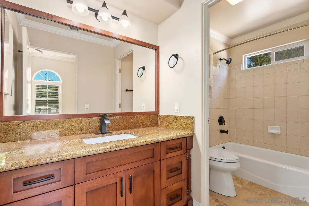 4103 Fallsbrae Road Fallbrook, CA 92028 - Photo 33 of 48 a bathroom with a granite countertop sink toilet and shower